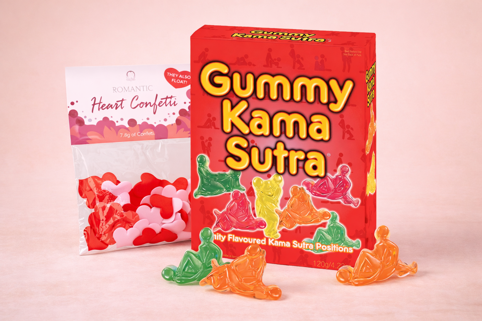 Gummy Kama Sutra candy box with heart-shaped confetti, colorful gummy figures on pink background