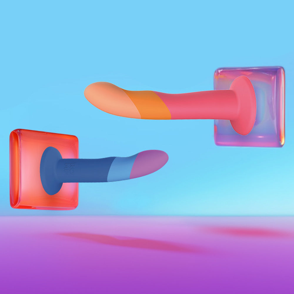 Colorful silicone strap-on dildos with suction bases on a blue and pink gradient background