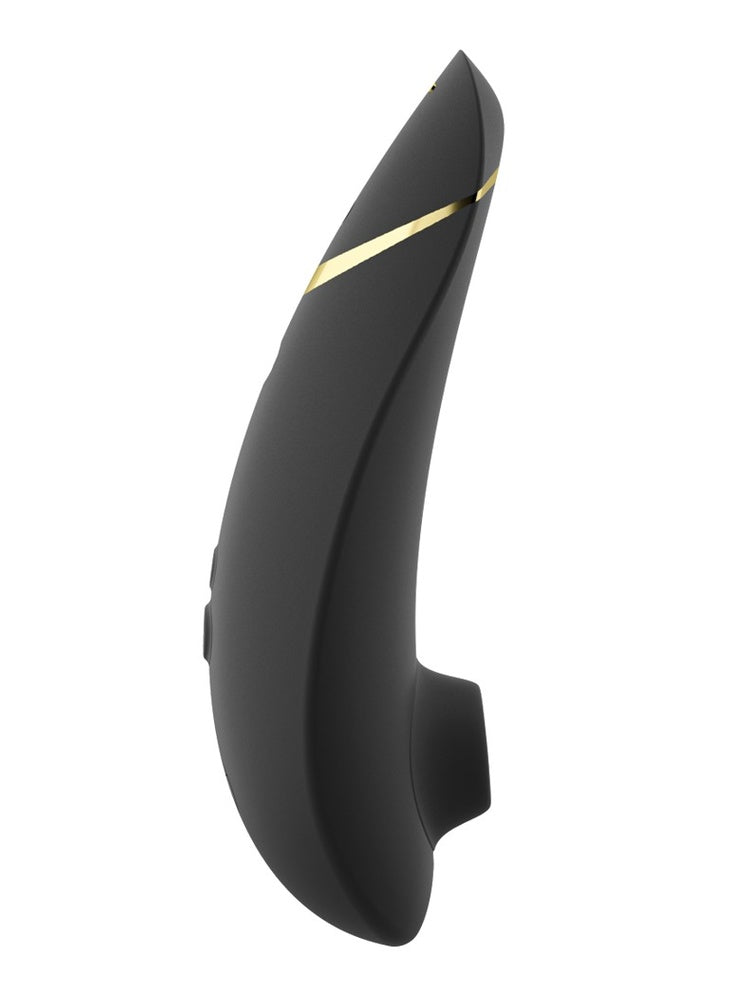 Womanizer Premium 2 sett fra motsatt side, med buet profil, gulldetalj og synlige kontrollknapper.