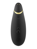 Womanizer Premium 2 sett bakfra, med kontrollpanel, logo og magnetiske ladekontakter.