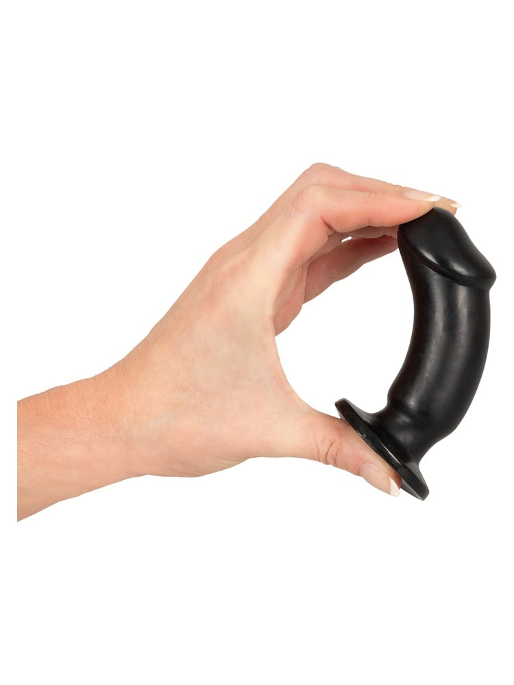 ANOS Buttplug Training Kit – hånd holder fleksibel svart plugg i buet form for å vise fleksibilitet