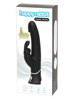 Happy Rabbit Realistic Vibrator i originalemballasje – hvit og svart produkteske med teksten “over 500,000 sold since 2012” og ikoner for 15 funksjoner, oppladbar, vanntett og travel lock.