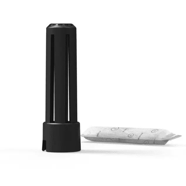 Black plastic storage capsule with a moisture-absorbing packet on white background