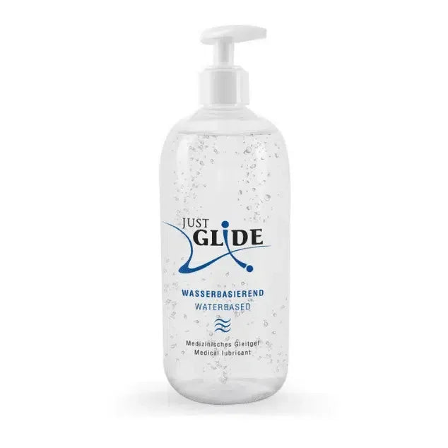 Clear pump bottle of Just Glide water-based medical lubricant with visible gel bubbles.
