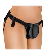Adjustable black strap-on harness worn on a model's waist and hips