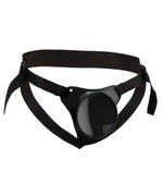 Adjustable black strap-on harness with a round central base, displayed on a white background
