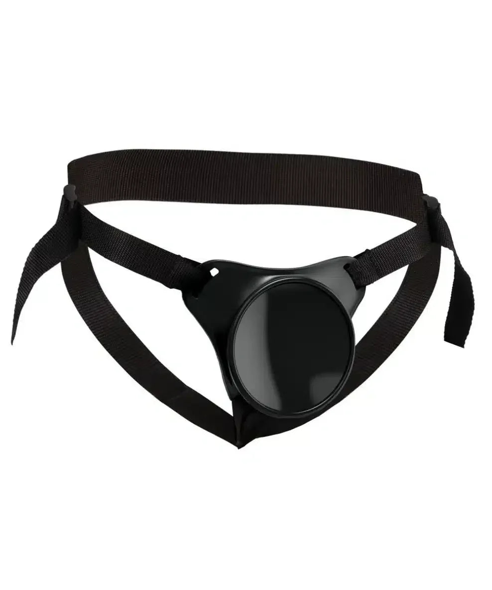 Adjustable black strap-on harness with a round central base, displayed on a white background