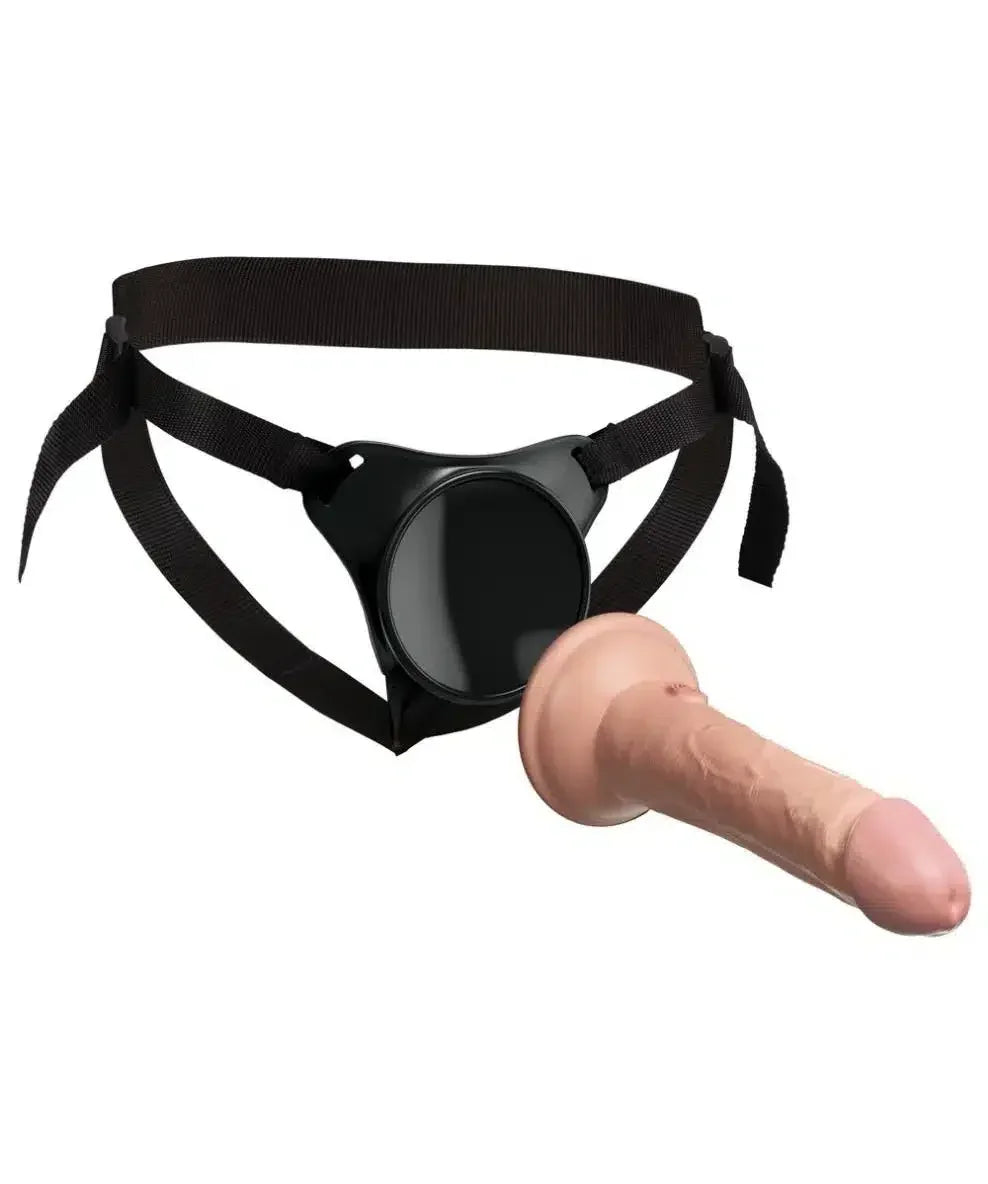 Adjustable strap-on harness with realistic silicone dildo attachment against white background.