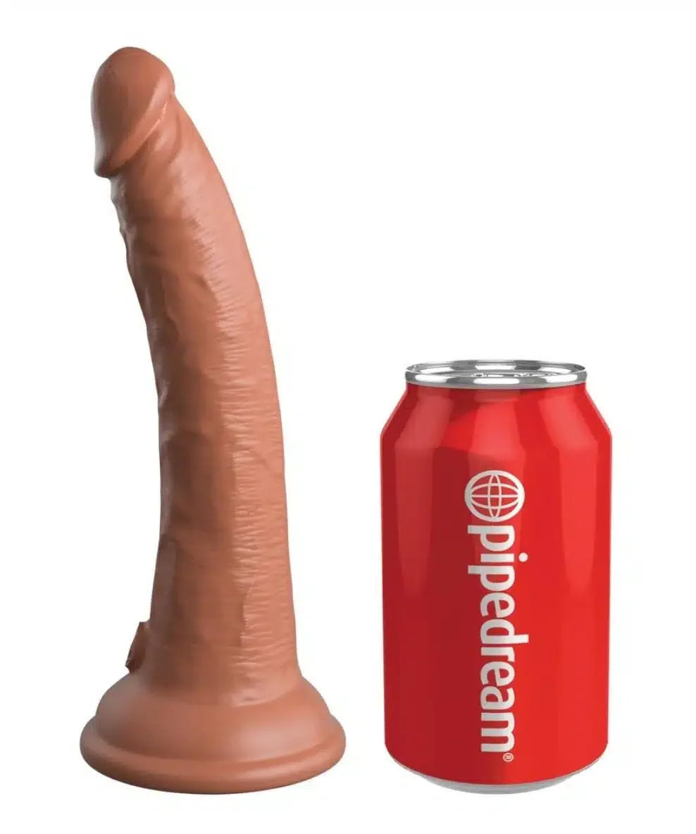 Realistic dildo with suction base next to a red soda can for size comparison, white background