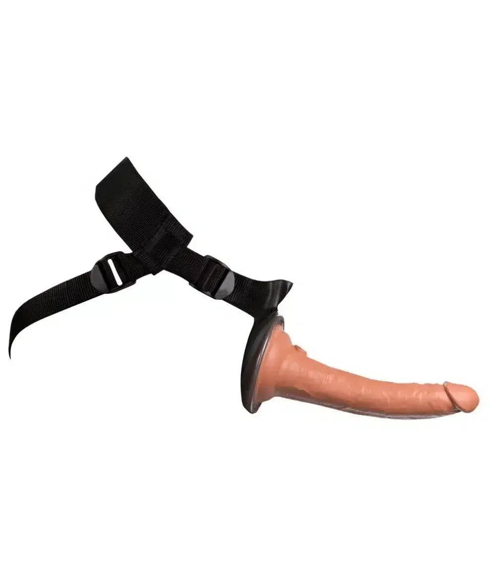 Realistic strap-on harness with flesh-toned dildo on white background, adult toy for couples
