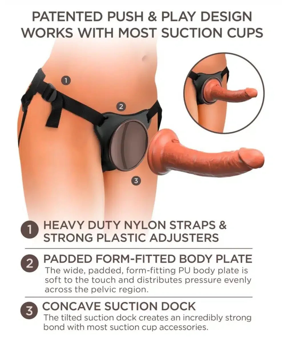Adjustable strap-on harness with suction cup base and realistic silicone attachment on a torso.