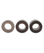 Set of three silicone rings in different sizes on white background