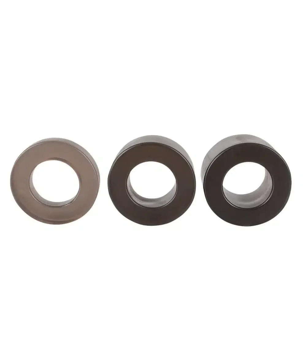 Set of three silicone rings in different sizes on white background