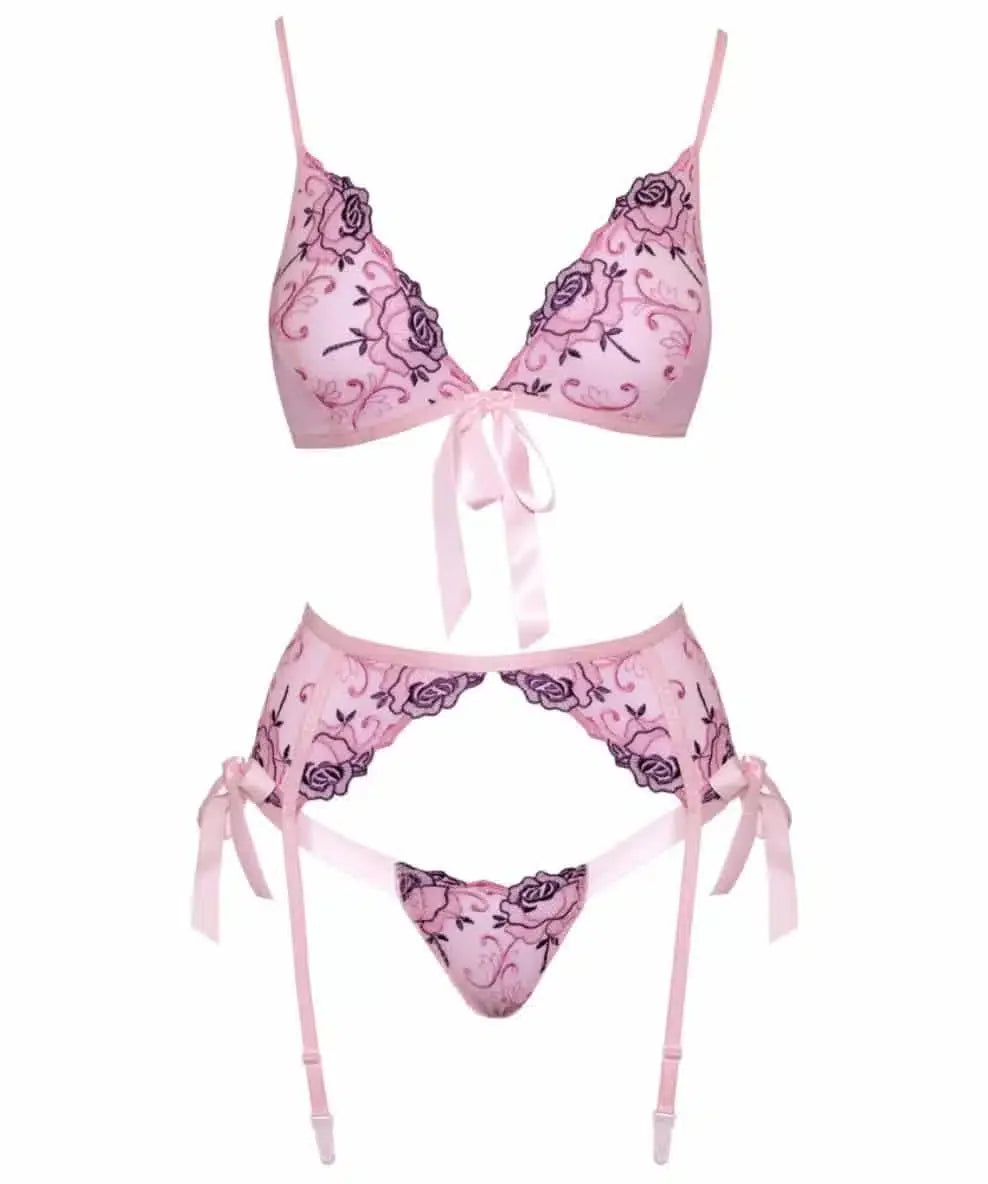 Pink lace lingerie set with floral embroidery, garter belt, and ribbon details