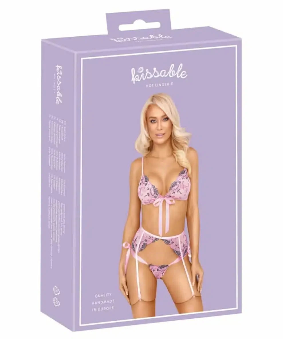 Box of Kissable hot lingerie featuring a model in pink lace bra and garter set