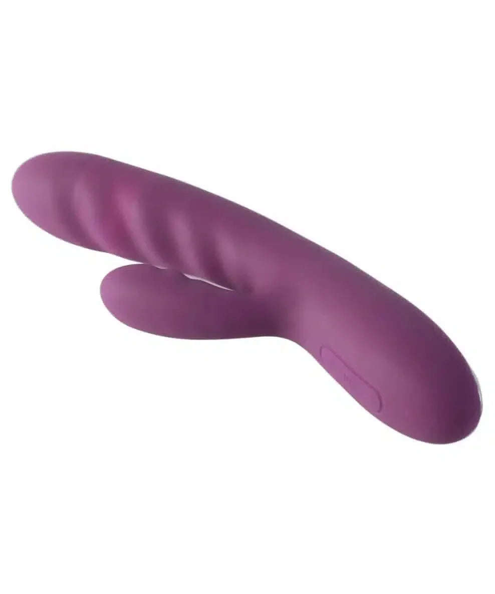 Purple silicone dual stimulation vibrator with ergonomic shape on white background