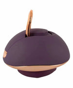 Purple and gold ergonomic personal massager with loop handle on white background