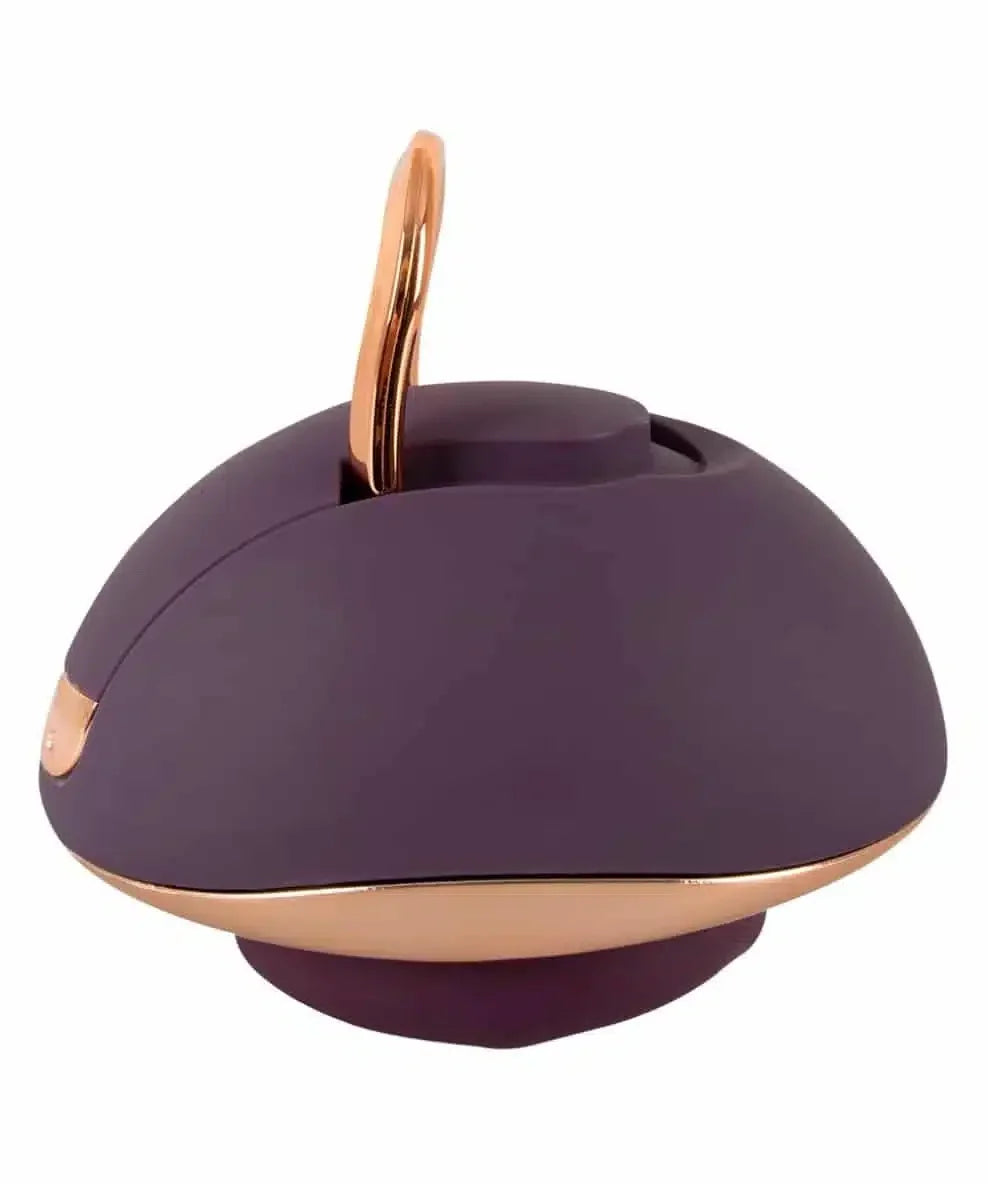 Purple and gold ergonomic personal massager with loop handle on white background