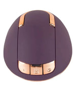 Purple and gold ergonomic personal massager with control buttons on a white background