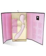 Pink ergonomic vibrator in elegant gold and pink packaging with product information.