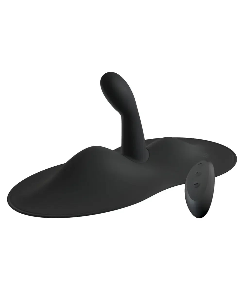 Black silicone vibrating anal plug with remote control on white background