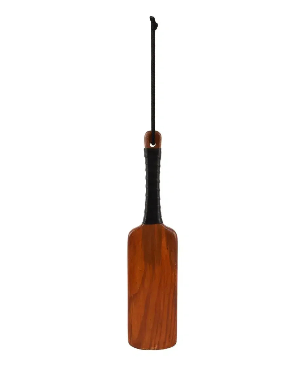Brown wooden paddle with black grip handle and hanging cord, against white background