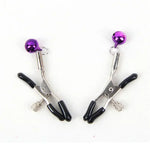 Silver nipple clamps with black silicone tips and purple bells on white background