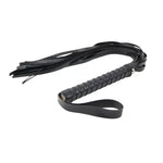 Black faux leather whip with wrapped handle and multiple tails for adult intimacy