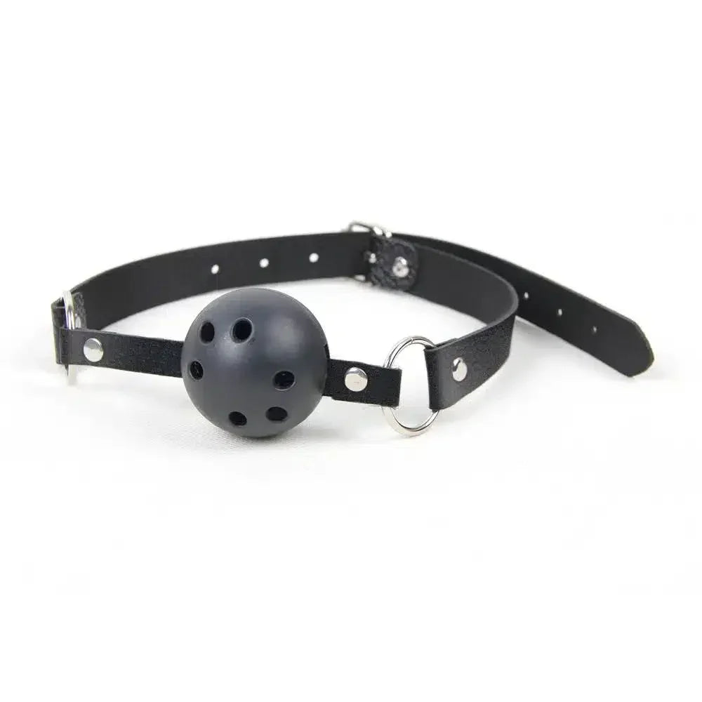 Black adjustable ball gag with ventilation holes and leather strap on white background