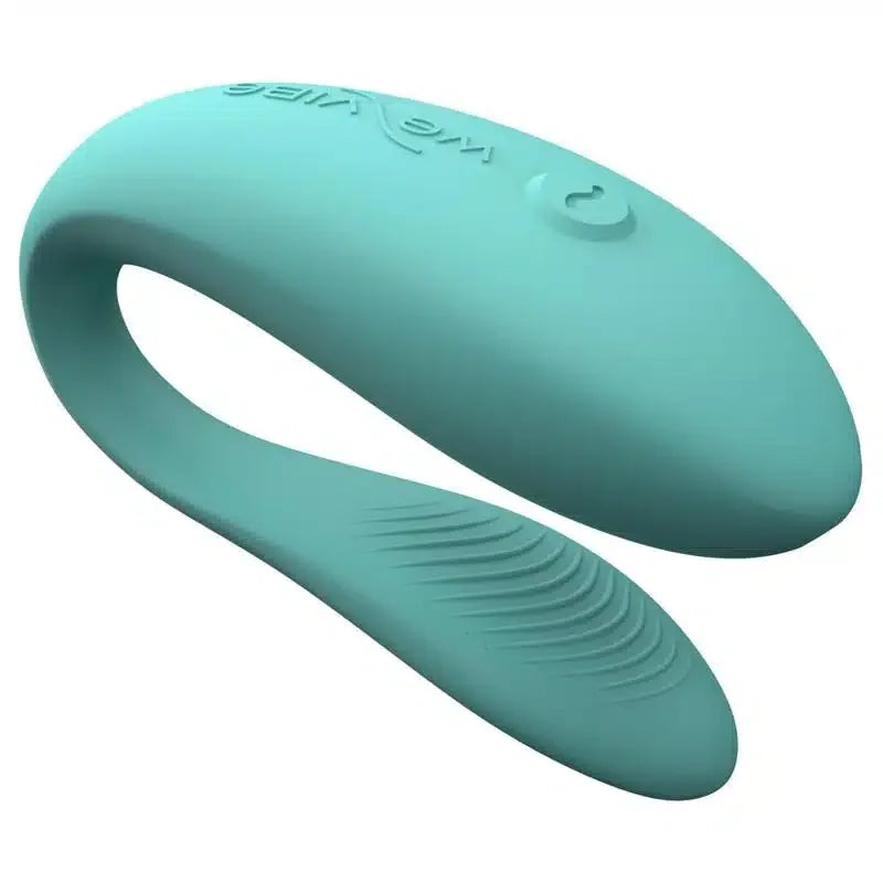 Teal silicone couples vibrator with curved design and textured surface, intimate wellness product