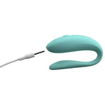 Rechargeable blue couple vibrator with charging cable on white background