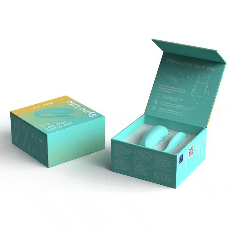 Turquoise wearable couples massager in open box, packaged for intimate use.