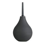 Black silicone bulb enema with narrow nozzle on white background
