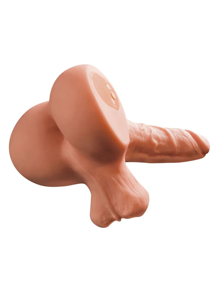Masturbator sett liggende skrått bakfra, viser kontrollpanel og produktets helhetsprofil mot hvit bakgrunn.