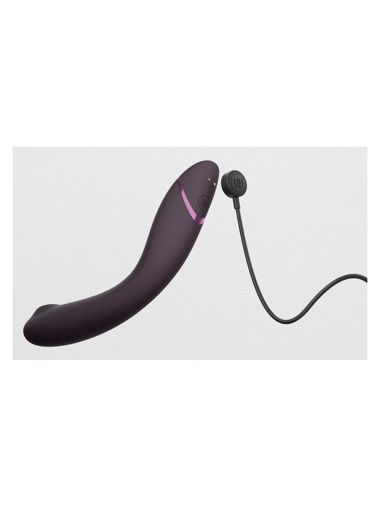 Womanizer OG med magnetisk ladekabel tilkoblet.