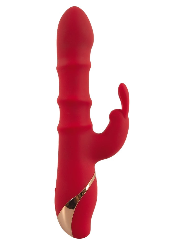 Rabbitvibrator liggende – oversiktsbilde som viser full lengde og klitorisarm.