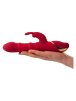 To vinkler av rabbitvibrator med magnetisk ladekabel tilkoblet.