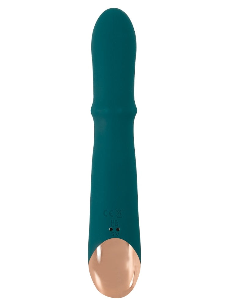 Thumping Rabbitvibrator sett bakfra – viser magnetiske ladekontakter og CE-merking på basen.