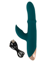 Vibrator med USB-magnetladekabel ved siden av – viser medfølgende tilbehør.