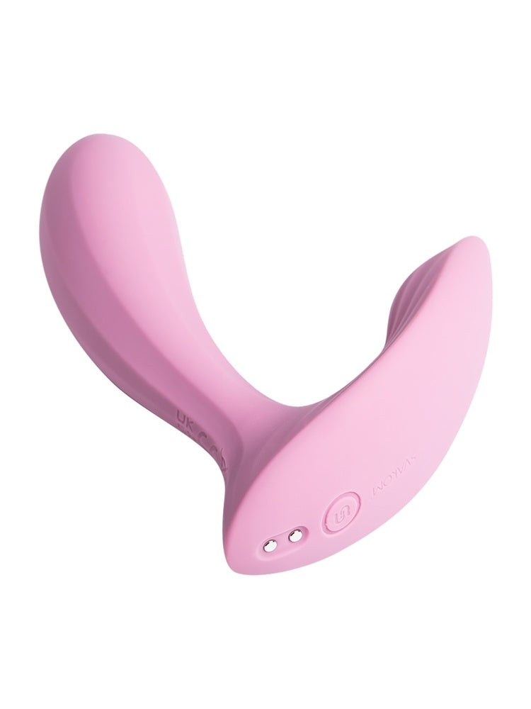 Svakom Erica trusevibrator, sett nedenfra forfra, med magnetiske ladepunkter og av/på-knapp synlig på bunnen