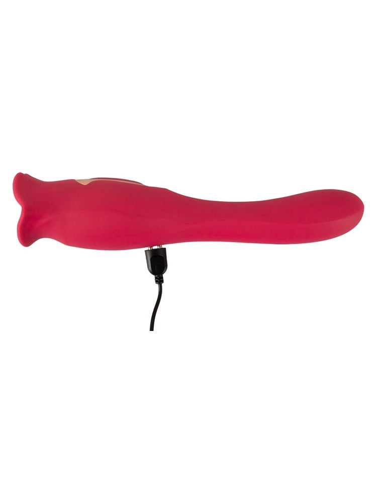 Sidevisning av tungevibrator med ladekabel tilkoblet