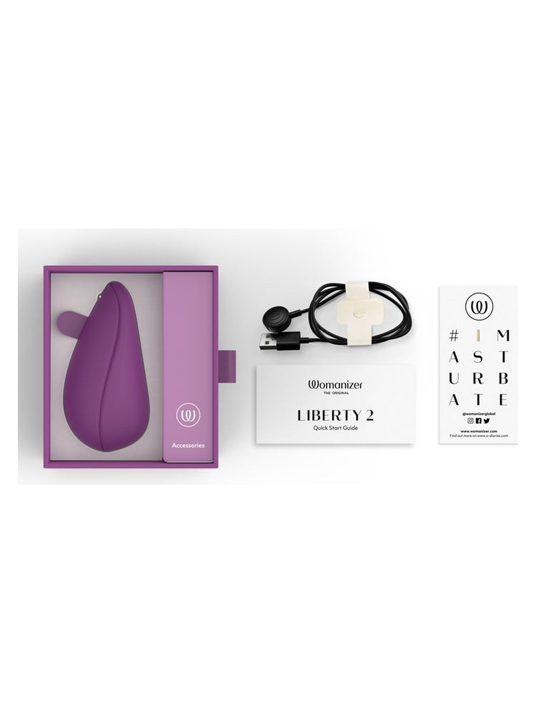 Womanizer Liberty 2 komplett innhold – stimulator, ladekabel, hurtigstartguide og 