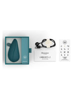 Innhold i pakken: Womanizer Liberty 2, ladekabel, hurtigstartguide og produktkort.