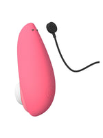 Womanizer Liberty 2 med magnetisk ladekabel tilkoblet.