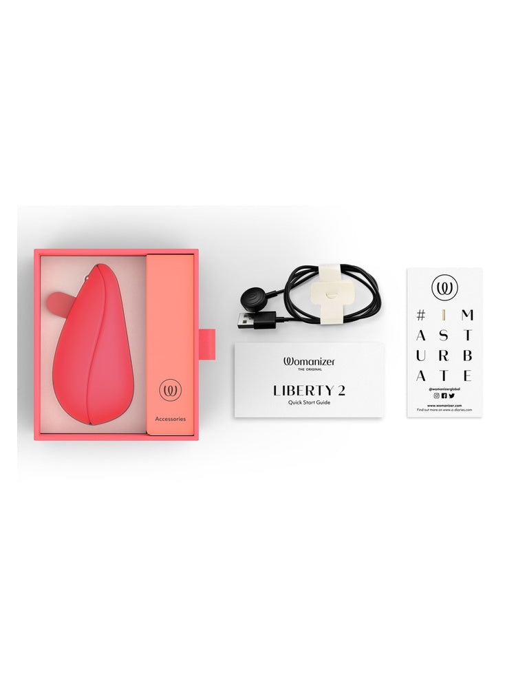 Innhold i pakken: Womanizer Liberty 2, ladekabel, hurtigstartguide og produktkort.