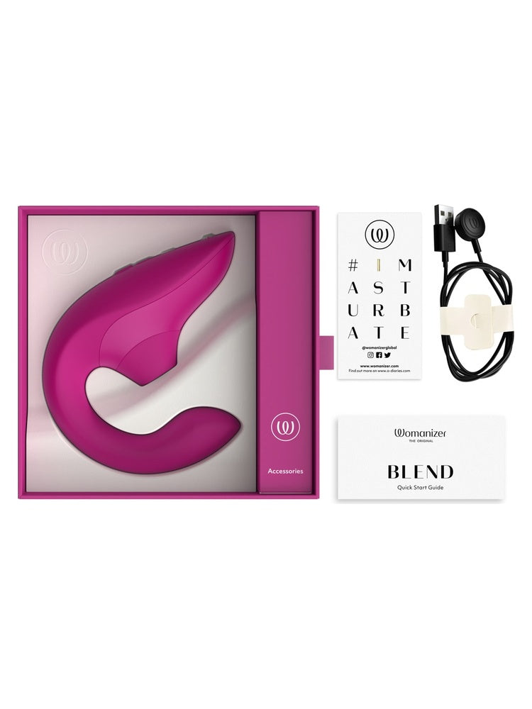 Womanizer Blend vibrator vist i åpen emballasje med tilbehør, ladekabel og hurtigstartguide