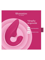 Forsiden av Womanizer Blend-esken i vibrant pink med produktnavn og funksjoner