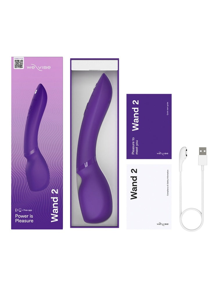 We-Vibe Wand 2 i åpen emballasje – viser sexleketøyet, USB-ladekabel og medfølgende dokumentasjon