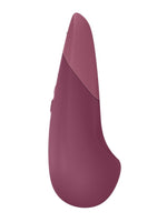 Womanizer Vibe klitorisstimulator i rosa, sett fra siden – viser buet form for presis stimulering