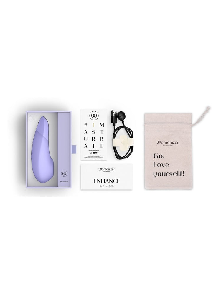 Innhold i pakken: Womanizer Enhance, ladekabel, oppbevaringspose og guider.